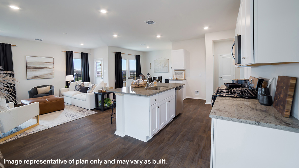 Open-concept kitchen, dining and living area with hard surface flooring and large windows.