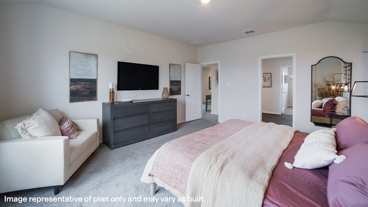 Spacious primary bedroom with quality carpet and ensuite bathroom.