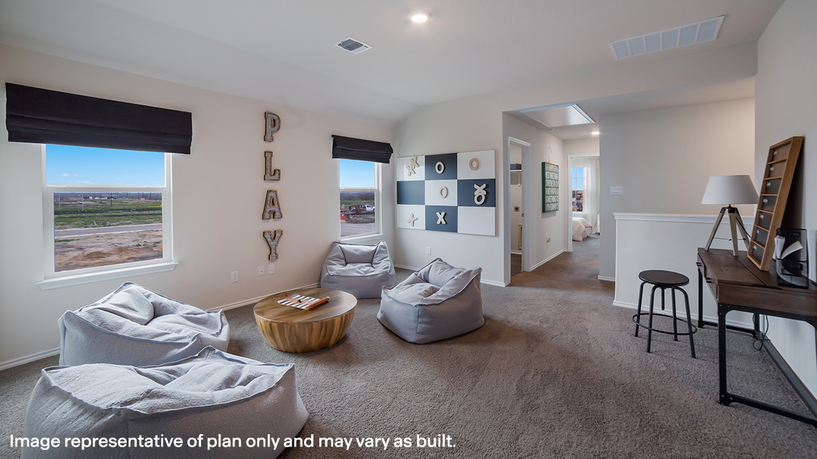 Spacious, open-concept loft at top of staircase with quality carpet and windows.