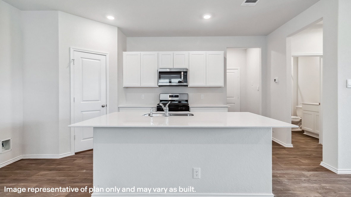 Spacious, open-concept kitchen with island, shaker style cabinets and granite or quartz countertops.