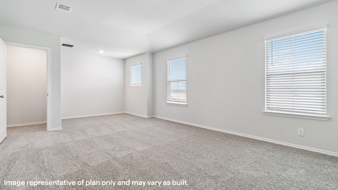 Spacious primary bedroom with sitting area, quality carpet and ensuite bathroom.