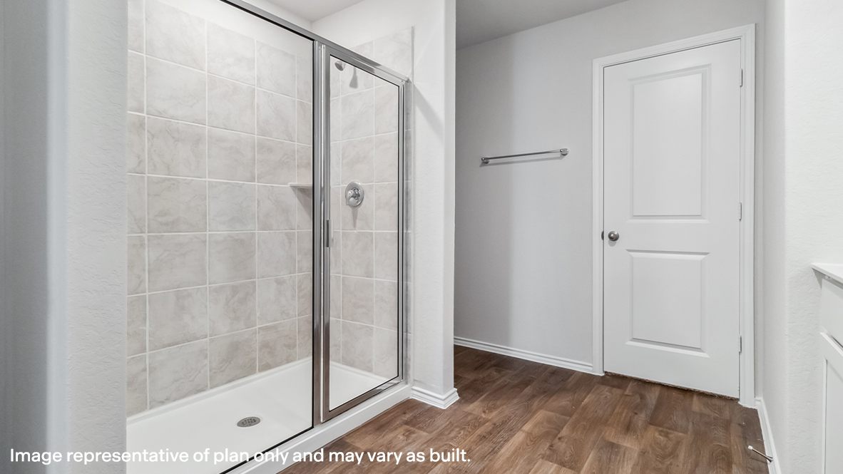 Spacious primary bathroom with plenty of counterspace, single vanity sink and hard surface flooring.