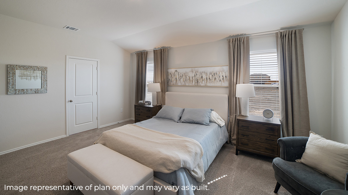 Spacious primary bedroom with sitting area, quality carpet and ensuite bathroom.