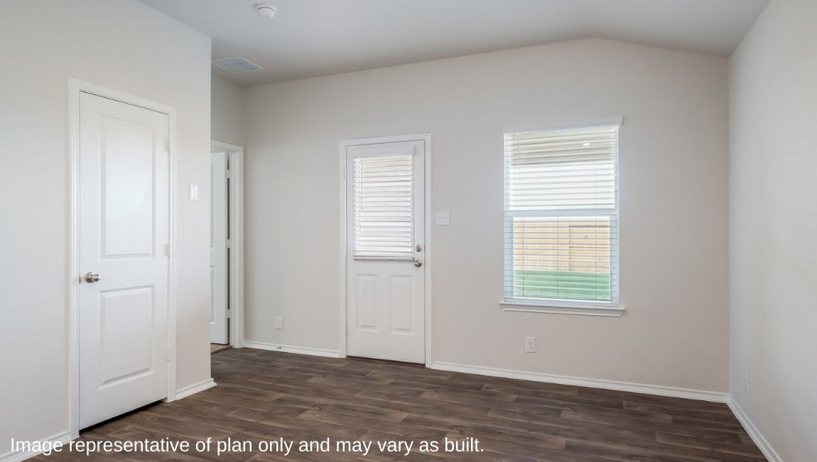 Dining area with windows, patio door and hard surface flooring.