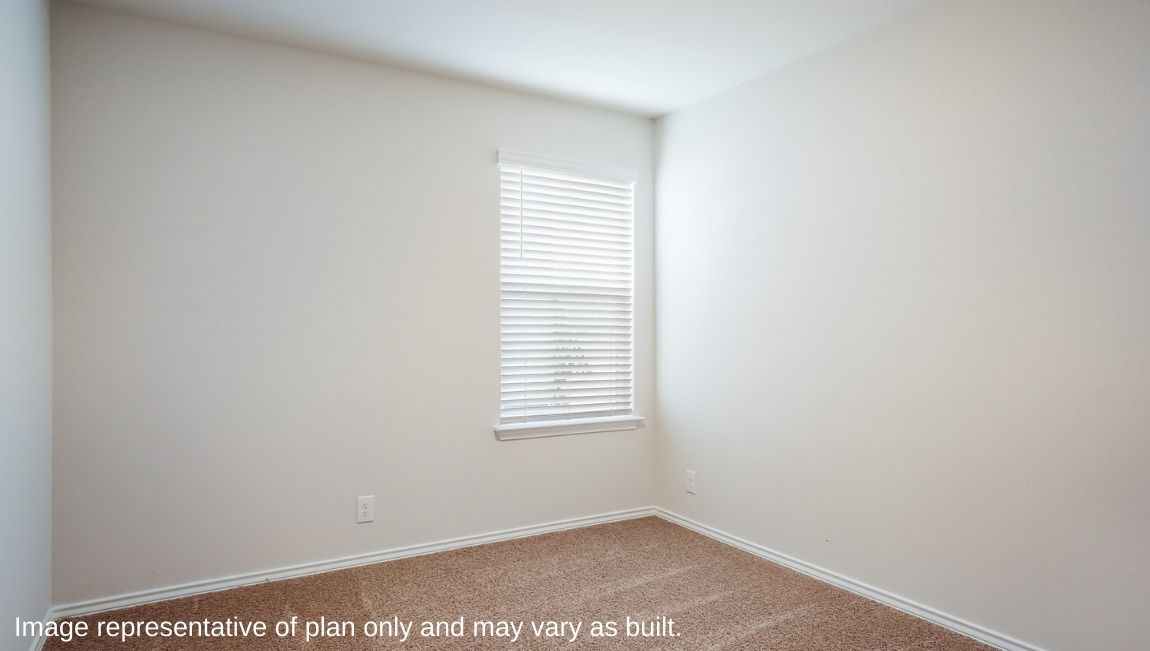 Third bedroom with quality carpet, window and closet.