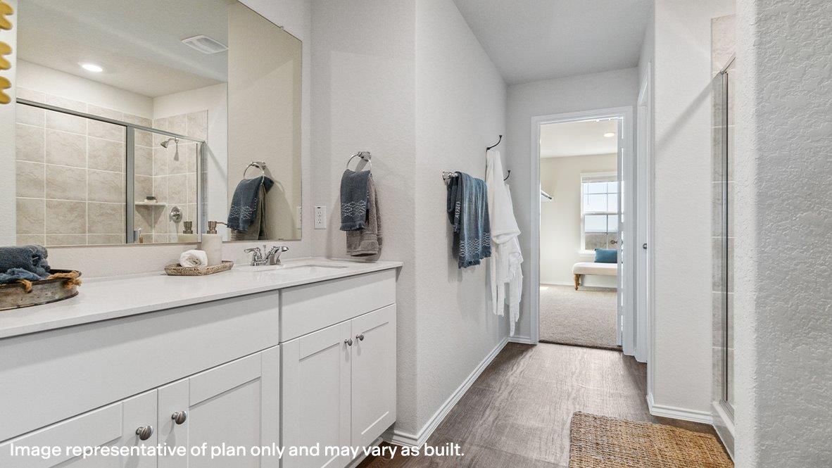 Primary bathroom with walk-in shower and closet.