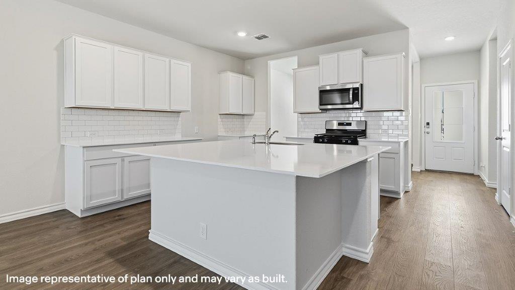 kitchen with large kitchen island and stainless steel appliances