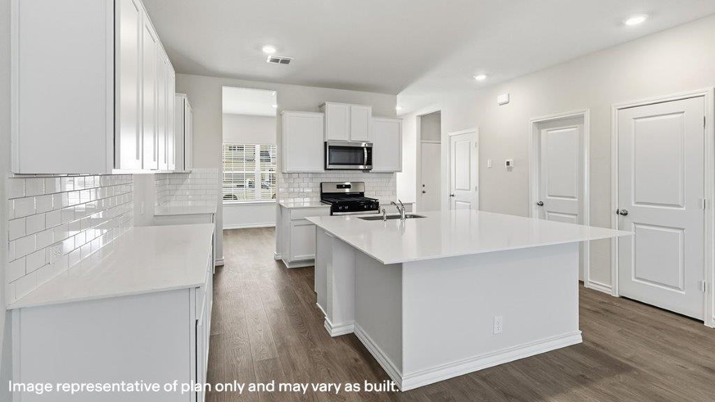 kitchen with large kitchen island and stainless steel appliances
