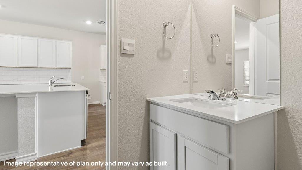 powder bathroom located off the kitchen