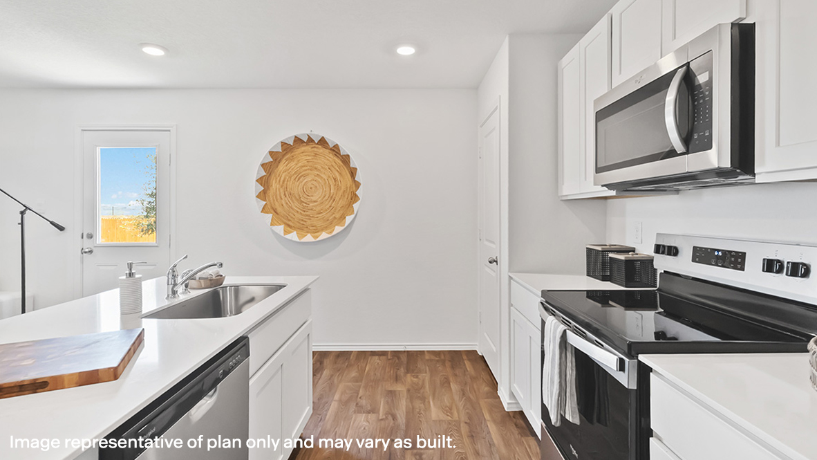 Kitchen island in this new home shares seamless imagination with a sink, dining,living areas and an open concept floor plan