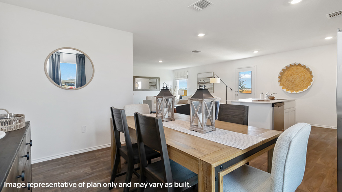 Dining room in Stonehill new home showcases our stylish open concept connectivity to main areas, outdoors, front entry
