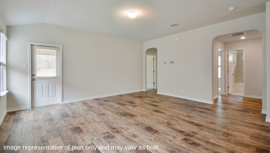 Primary bedroom located off family room with ensuite bathroom and quality carpet.