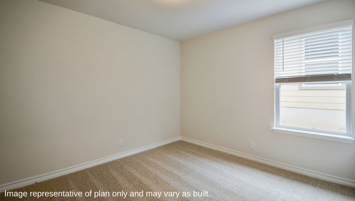 Third bedroom with quality carpet and window.