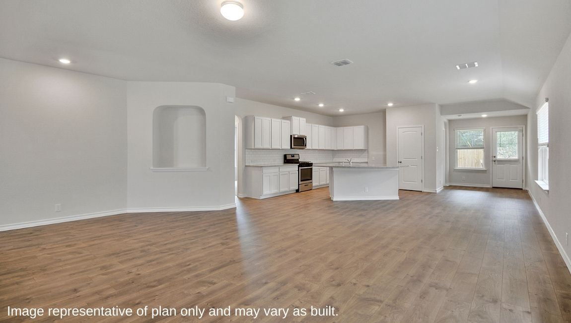 Large decorative wall nook and spacious open-concept family room and kitchen,