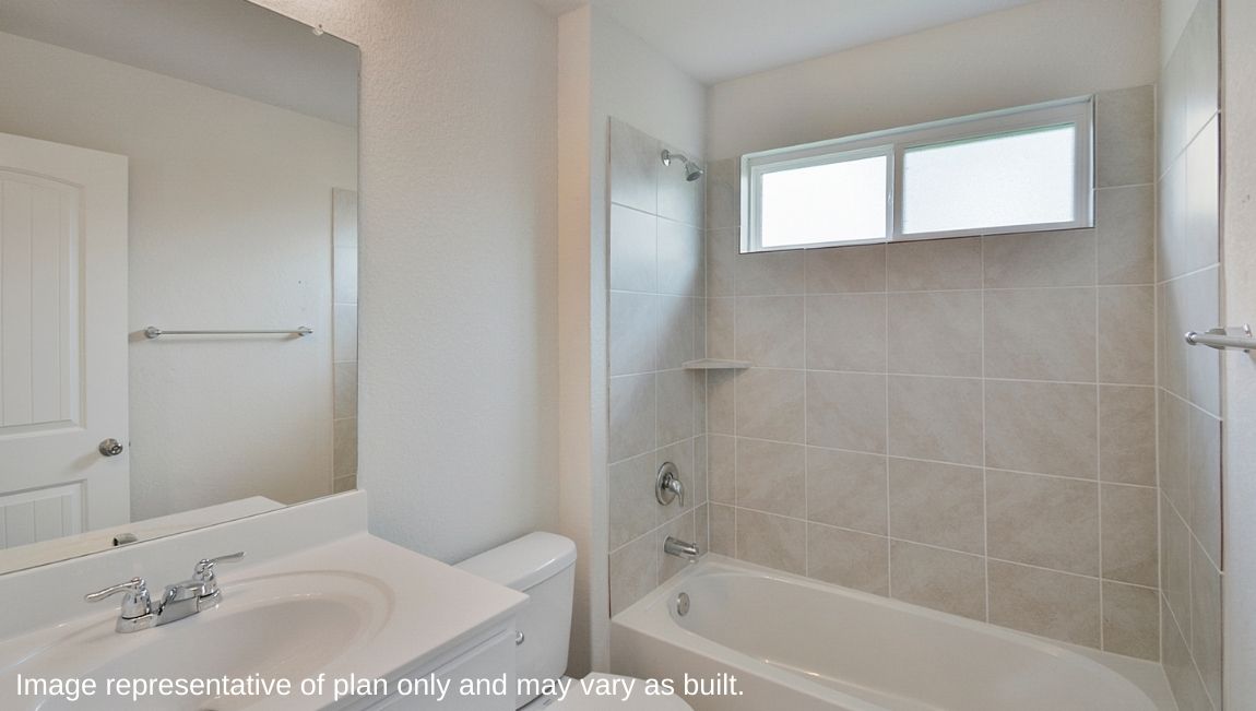 Second full bathroom with combined bathtub and shower, toilet and hard surface flooring.