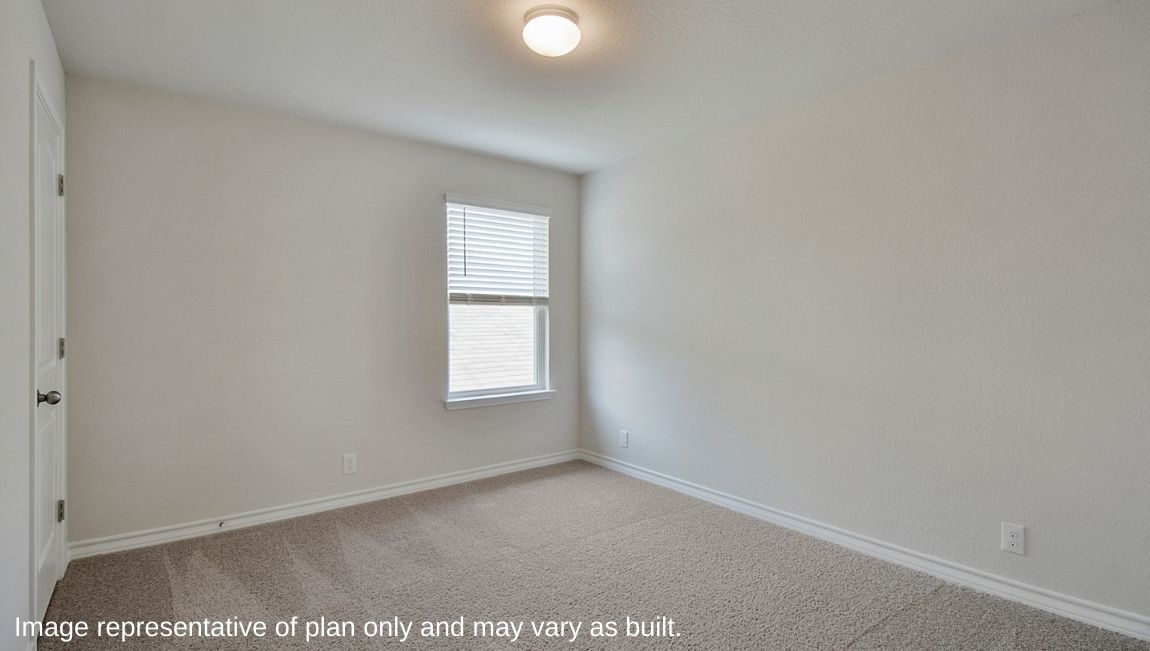 Third bedroom with quality carpet, window and closet.