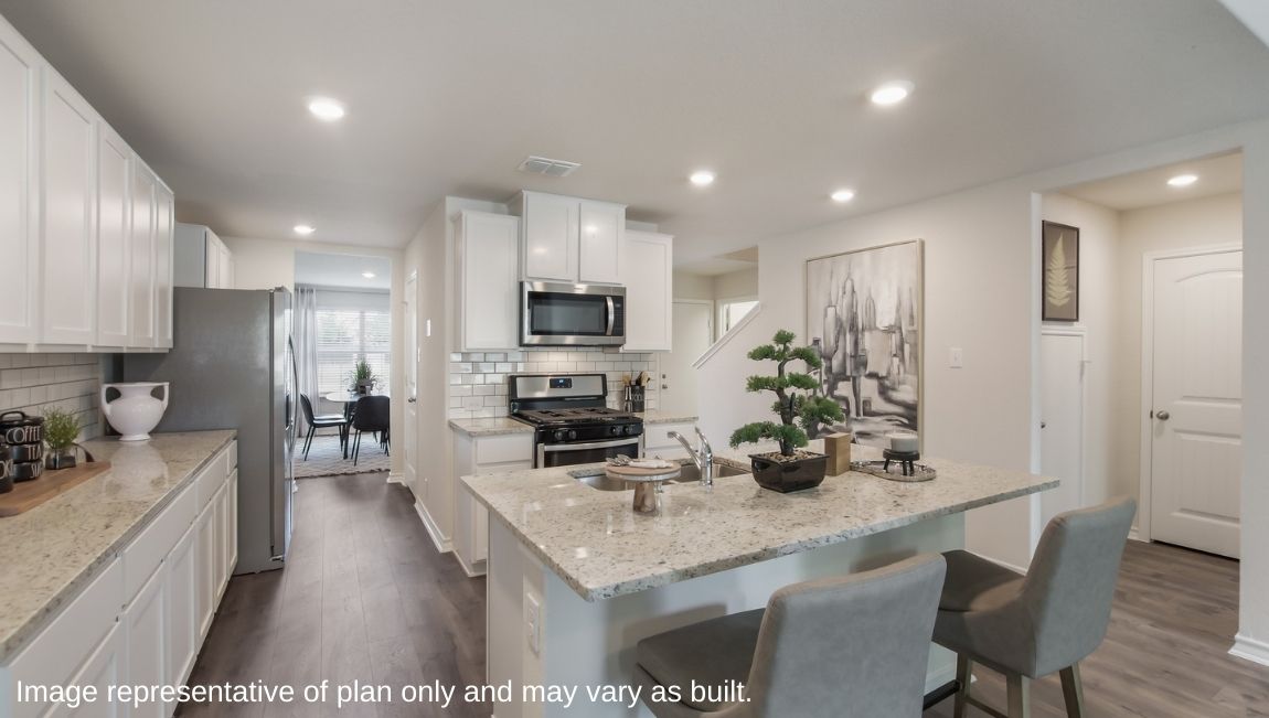 Butler entry connecting dining room and spacious kitchen.