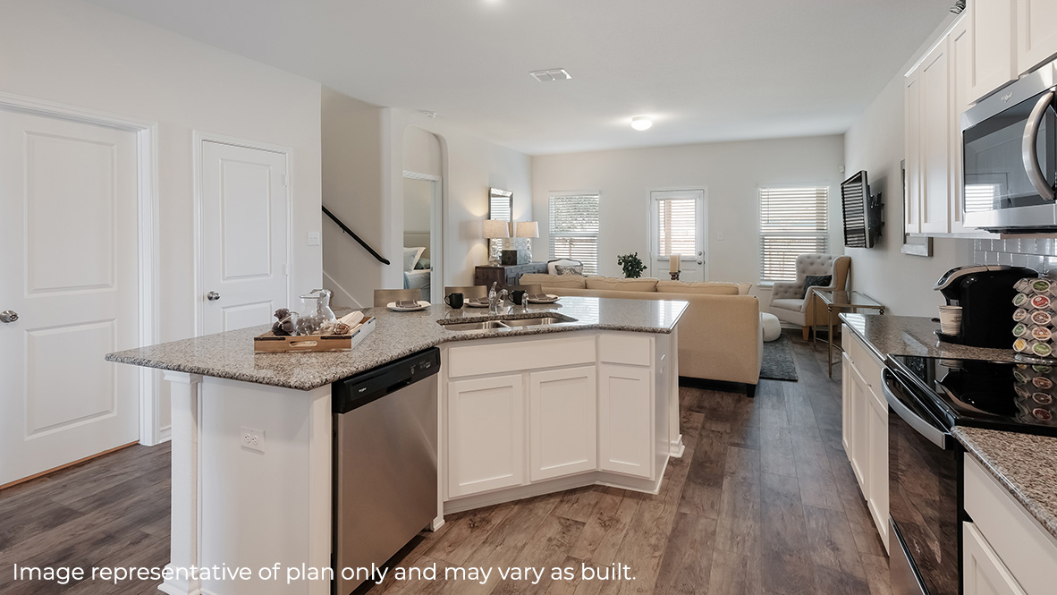 Spacious kitchen lined with plenty of cabinet space and counterspace.