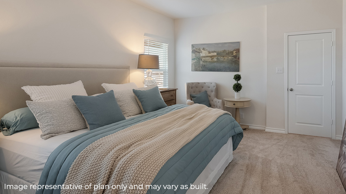Primary bedroom with quality carpet and large windows providing plenty of natural light.