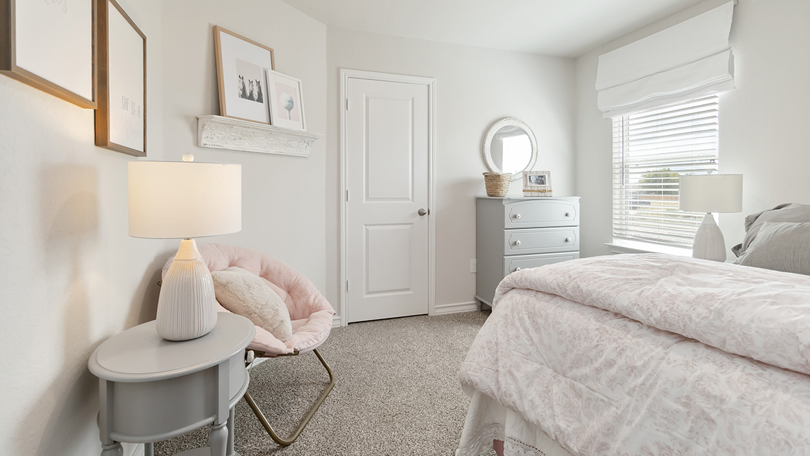 fourth bedroom with carpet flooring and window