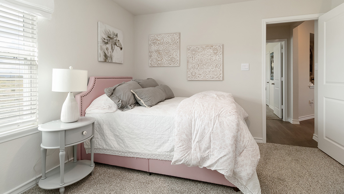 fourth bedroom with carpet flooring and window