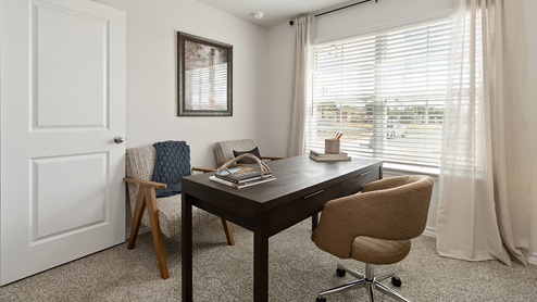 secondary bedroom or flex space with quality carpet flooring and large windows