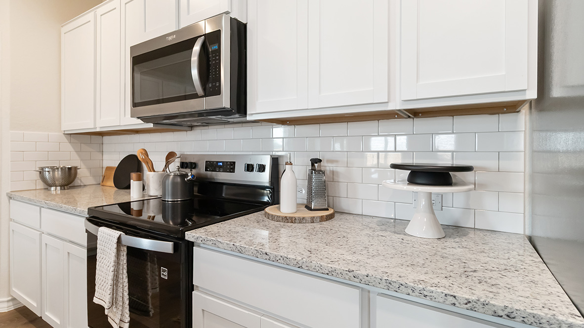 kitchen with stainless steel appliances, abundant cabinets and kitchen island with deep single basin sink