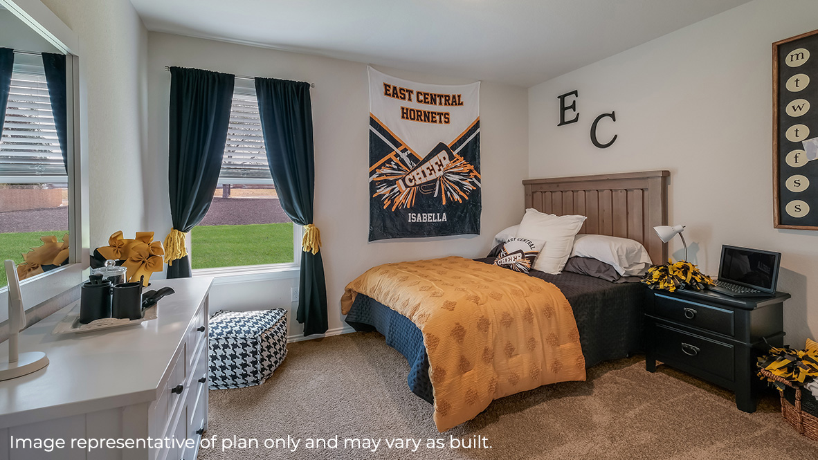 Secondary bedroom with quality carpet, closet and windows.