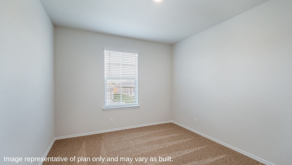 Third bedroom with quality carpet, window and closet.