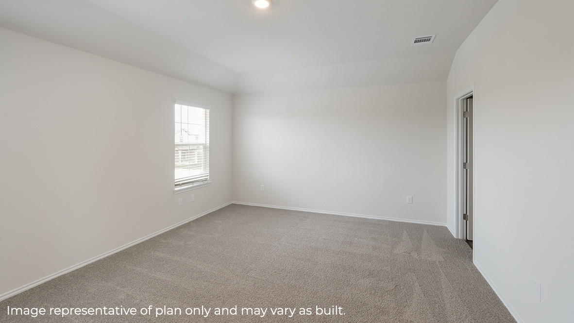 Spacious primary bedroom with sitting area, quality carpet and ensuite bathroom.