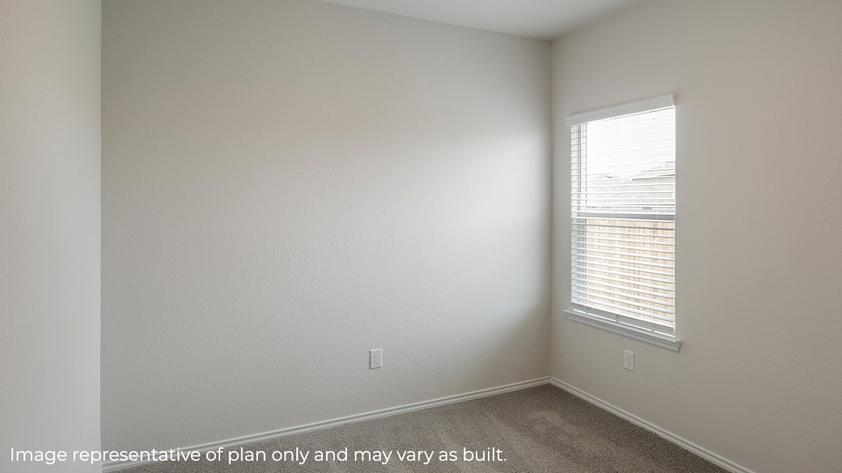 Secondary bedroom with carpet, closet and window.