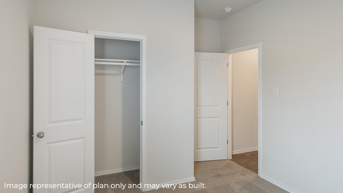 Secondary bedroom closet with shelving.