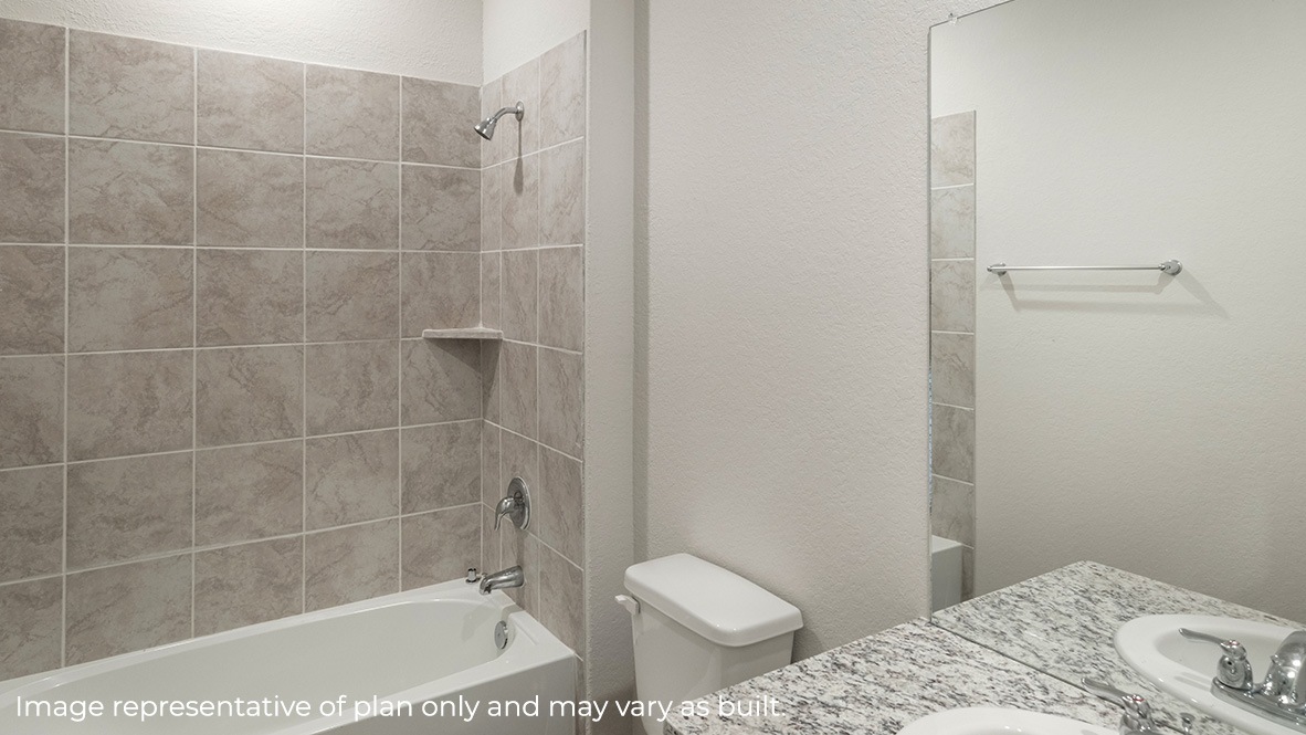 Third full bathroom with combined bathtub and shower, toilet and hard surface flooring.