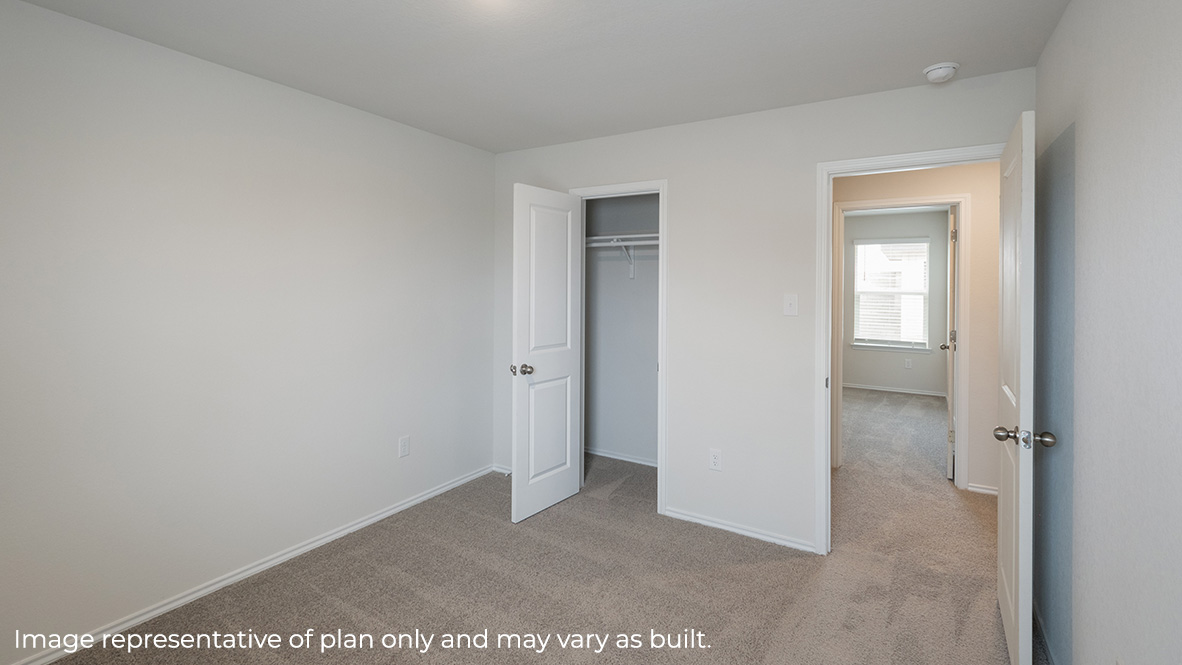 Fifth bedroom closet with shelving.