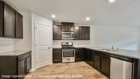 DR Horton San Antonio The Canyons at Amhurst 12026 topaz stream the walsh floor plan 2 story 2 car garage 2323 square feet kitchen with hard surface flooring stainless steel appliances dark cabinetry granite countertops and corner pantry
