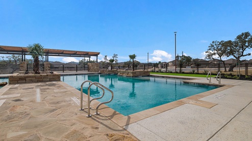 Bulverde Texas DR Horton Homes Copper Canyon New Construction Homes outdoor pool with beach entry and covered pavilion