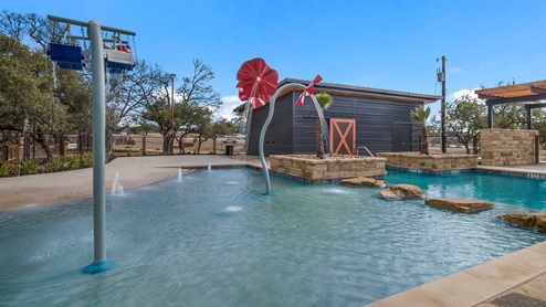 Bulverde Texas DR Horton Homes Copper Canyon New Construction Homes outdoor splash pad with water features and covered pavilion