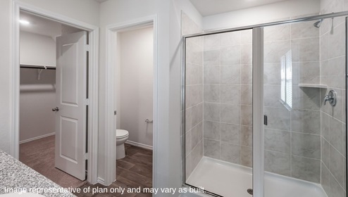 DR Horton San Antonio Laurel Vistas the brooke floor plan 1396 square feet main bedroom ensuite bathroom with tiled walk in shower and separate doors for the water closet and walk in closet