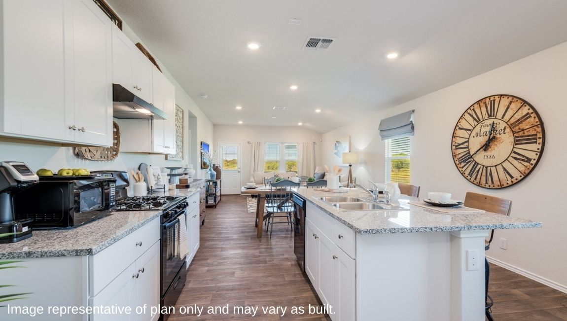 DR Horton San Antonio Laurel Vistas the caroline floor plan 1489 square feet open concept kitchen with shaker style cabinets and granite countertops flowing to dining area and living room