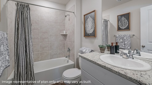 DR Horton San Antonio Laurel Vistas the diana floor plan 1535 square feet secondary bathroom with combined tube and shower, toilet, and single vanity sink with granite countertop
