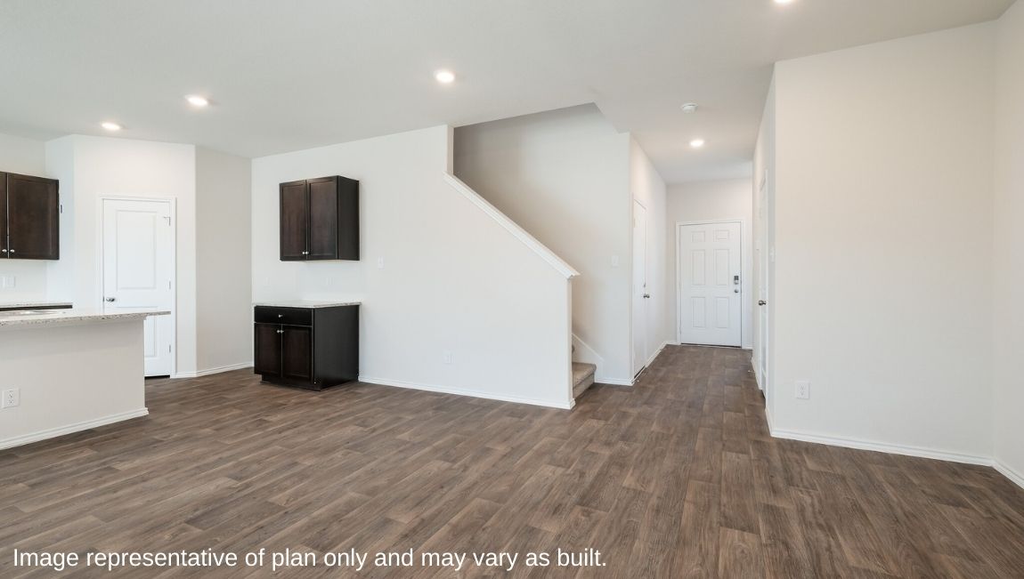 DR Horton San Antonio Laurel Vistas the emma floor plan 1700 square feet open concept living room with hard surface flooring flowing into kitchen and dining area