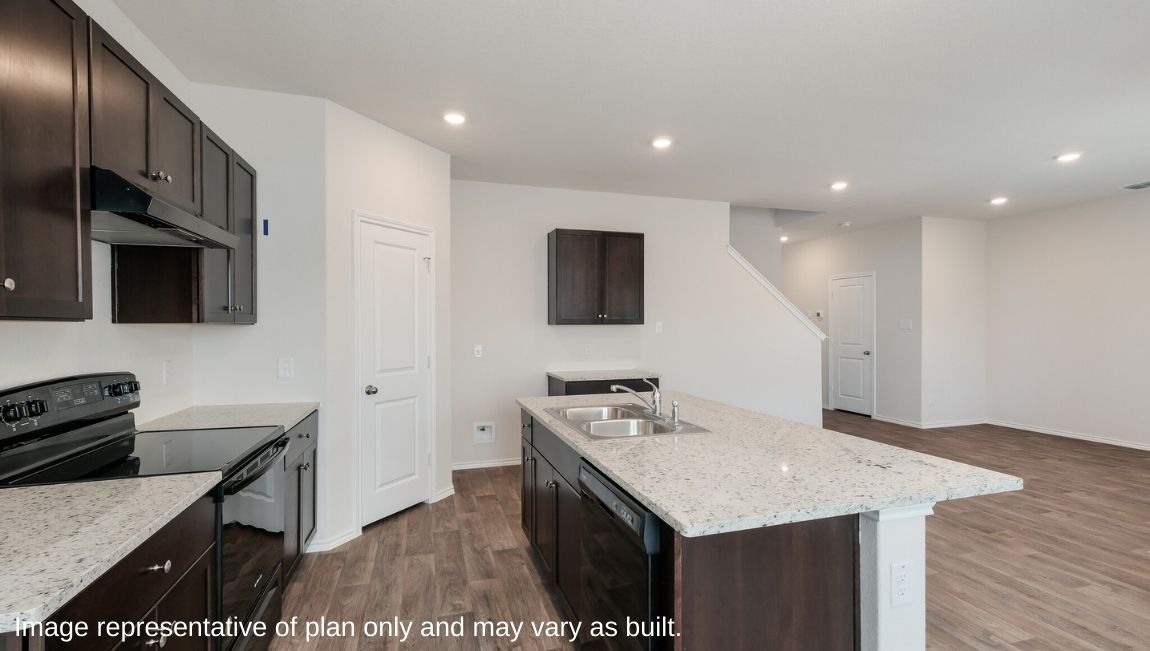 DR Horton San Antonio Laurel Vistas the emma floor plan 1700 square feet kitchen with granite countertops and large kitchen island overlooking living room with hard surface flooring