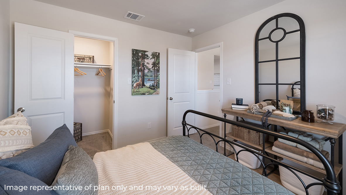 DR Horton San Antonio Laurel Vistas the hanna plan 2042 square feet secondary bedroom with twin bed, vanity dresser and closet