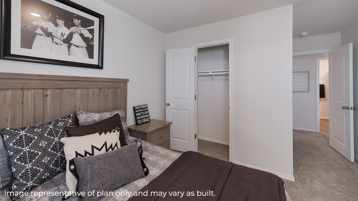 DR Horton San Antonio Laurel Vistas the hanna plan 2042 square feet secondary bedroom with full sized bed, side tables, carpet flooring and closet
