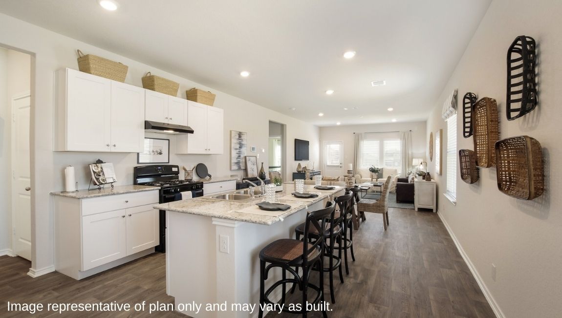 DR Horton San Antonio Laurel Vistas the jasmine floor plan 2182 square feet open concept kitchen and kitchen island leading into dining area and living room with hard surface flooring throughout