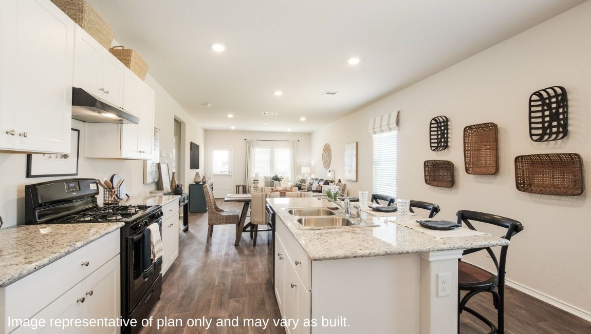 DR Horton San Antonio Laurel Vistas the jasmine floor plan 2182 square feet open concept kitchen with granite countertops, shaker style cabinets, and large kitchen island with sink leading into open concept dining area and living room with hard surface flooring throughout