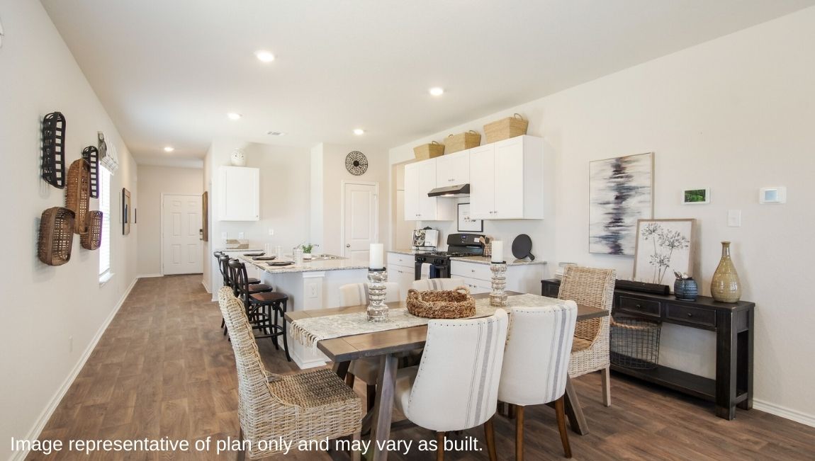 DR Horton San Antonio Laurel Vistas the jasmine floor plan 2182 square feet open concept dining area with farmstyle table and small buffet leading into kitchen with shaker style cabinetry