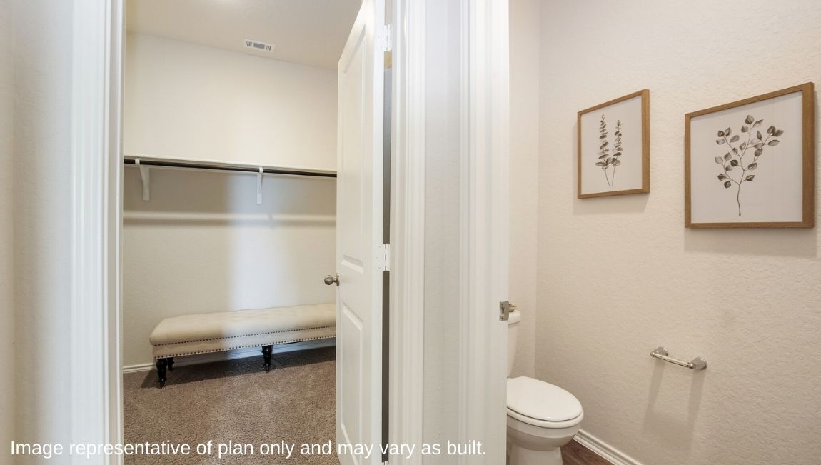 DR Horton San Antonio Laurel Vistas the jasmine floor plan 2182 square feet main bedroom ensuite bathroom with separate water closet for toilet and carpeted walk in closet with shelving and railing