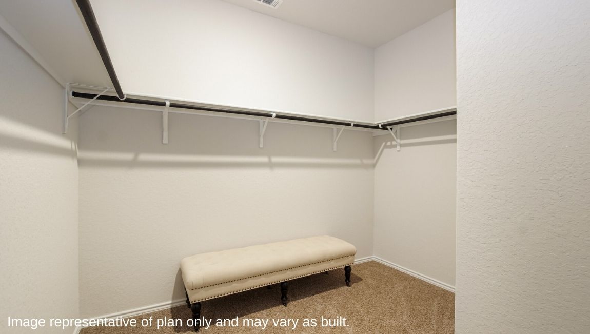 DR Horton San Antonio Laurel Vistas the jasmine floor plan 2182 square feet main bedroom carpeted walk in closet with shelving, railings, and ottomon