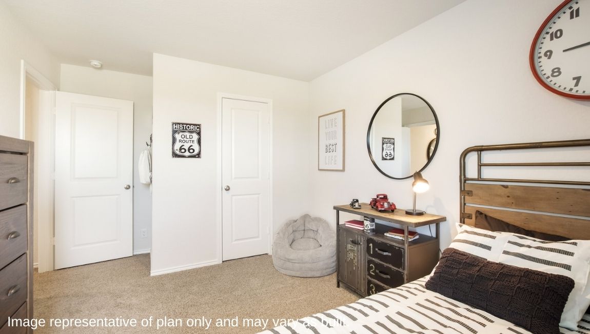 DR Horton San Antonio Laurel Vistas the jasmine floor plan 2182 square feet secondary bedroom with carpet flooring, twin sized bed, dresser and side table